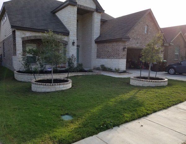 Landscaping Stone Planters in Front Yard of a Home