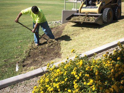 Landscaper Removing Existing Grass