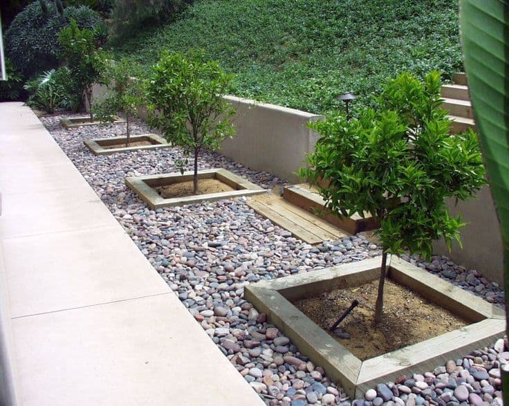 Planter Beds installed using 4x6 Timbers & Smooth Colorful River Rock
