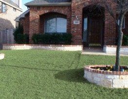 Stone Planters with Brick Cap Installed Front yard