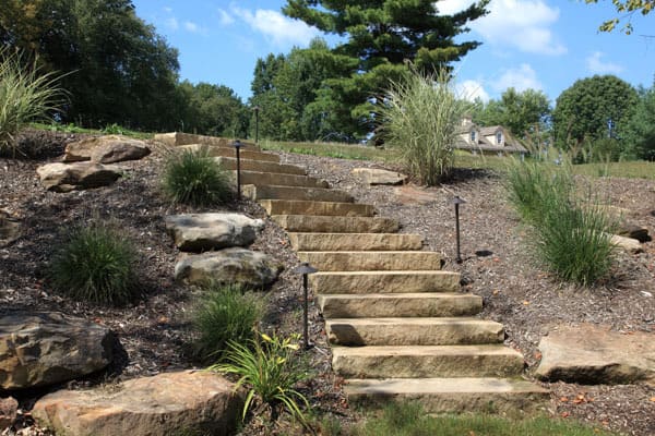 Thick Flagstone Slabs used to Create Beautiful Steps in a Landscape Project