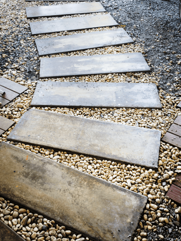 Close-up image of a pathway built with slate stones and pebble rocks