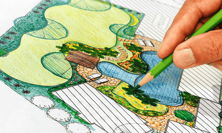 Landscape Architect drawing landscape design with colored pencil