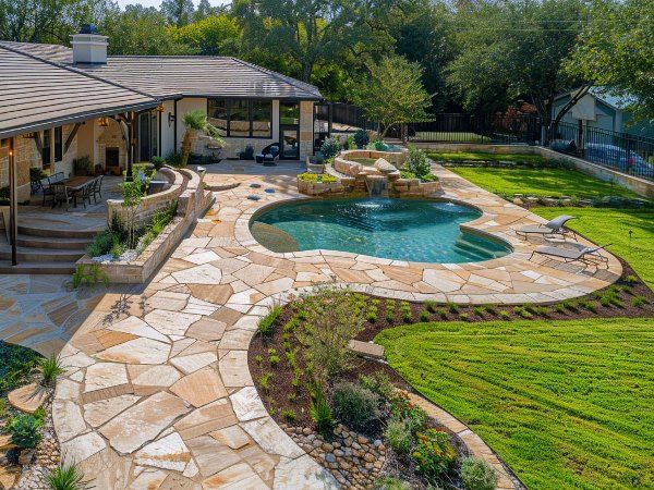 Stunning flagstone patio installation in Helotes, TX, with elegant design and durable craftsmanship