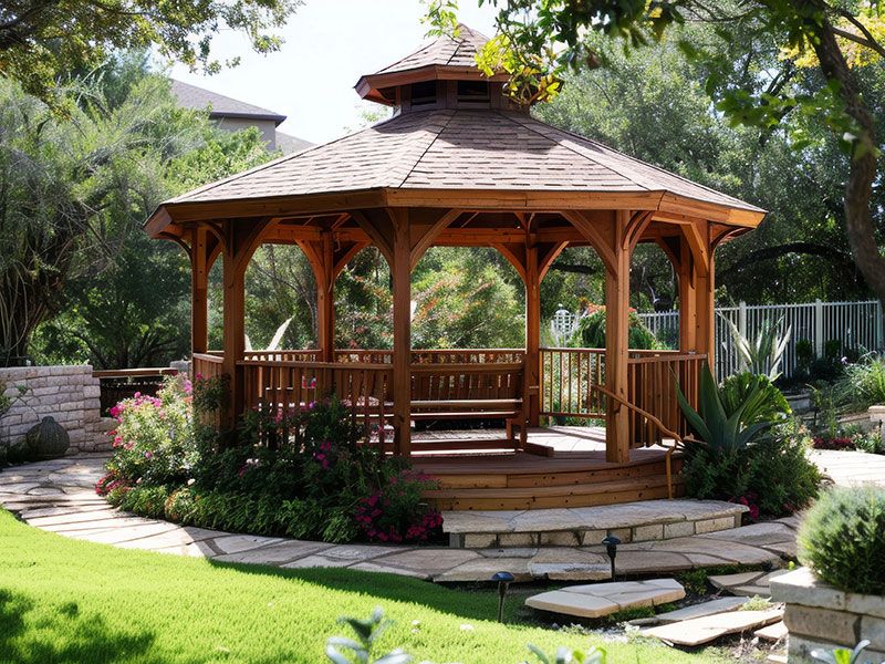 Beautiful Cedar Gazebo with Roofing Shingles and Elegant Railing in a Lush Garden Setting