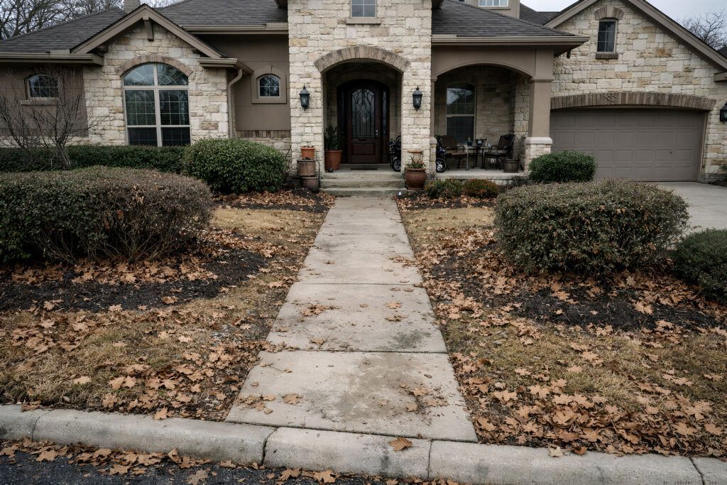San Antonio front yard before landscaping refresh, existing lawn and beds prior to drought-tolerant landscape design